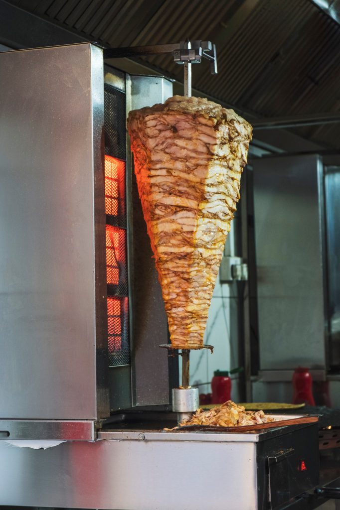 Traditional Turkish Food. Turkish Kebab Doner in vertical fired oven.